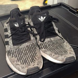 Black and white adidas tennis shoes